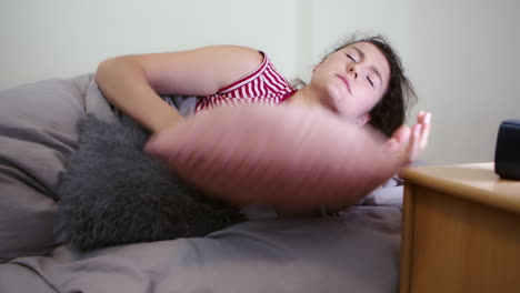 Female-trying-to-sleep,-insomnia-or-sleeping-problem-concept,-closeup-view-of-head-and-pillow-in-bed