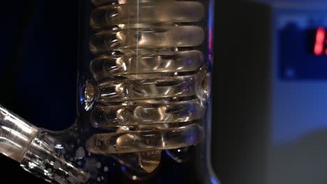 close-up of a glass condenser in a laboratory setting