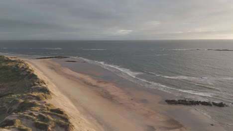 Aerial-view-of-Ofir-Beach-in-Esposende,-Portugal,-with-expansive-sandy-shores-and-calm-ocean-waves