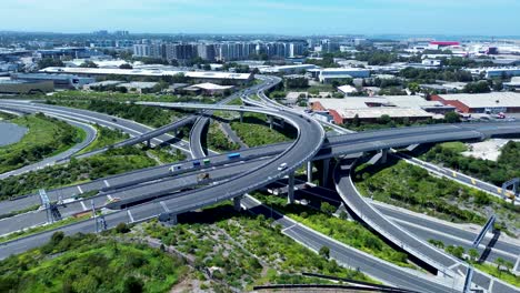 Drone-aerial-landscape-view-cars-driving-over-highway-freeway-underpass-bridge-in-St-Peters-Marrickville-Sydney-infrastructure-Australia