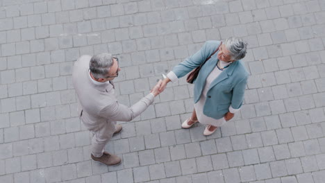 city, handshake top view and business people