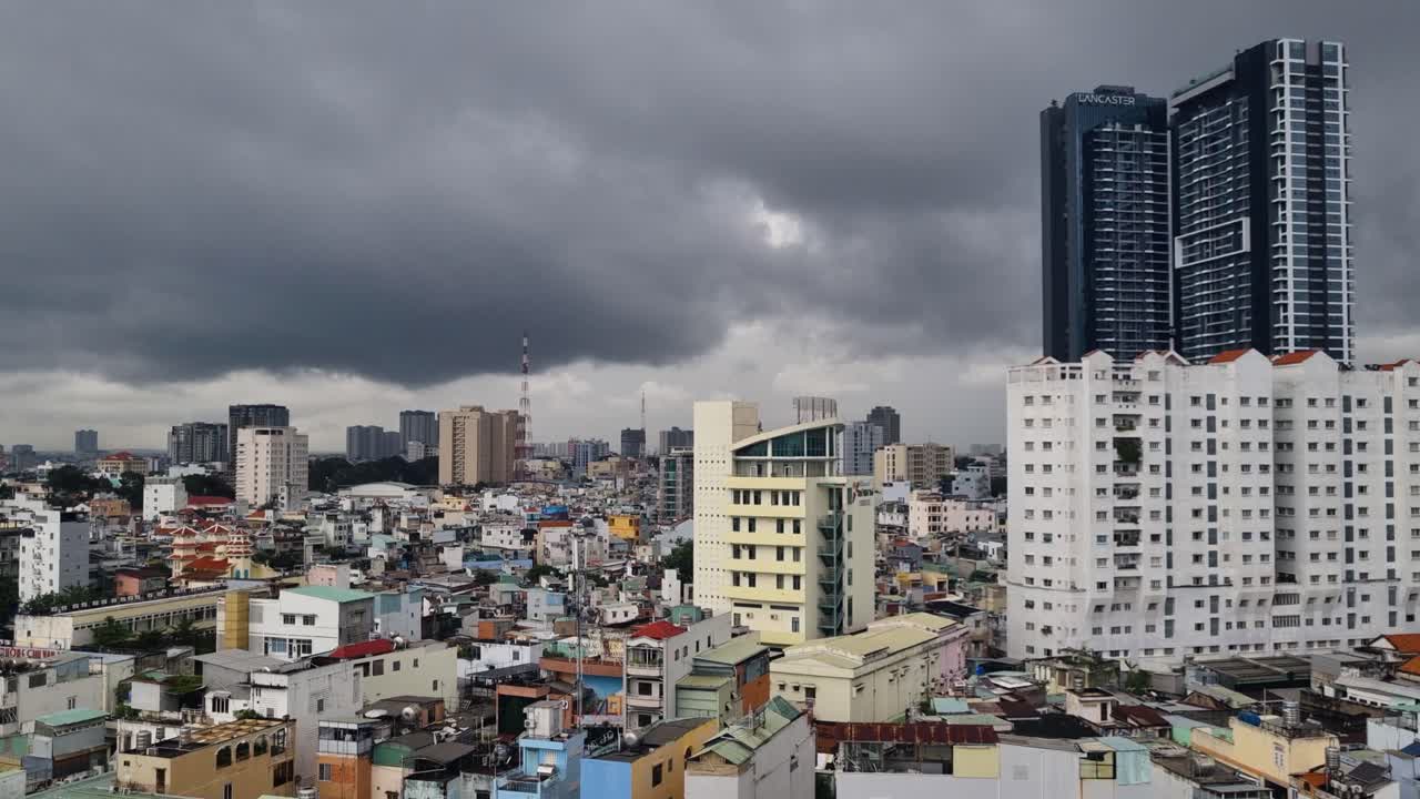 Under a moody monsoon sky, Ho Chi Minh City’s skyline unfolds with varied heights and styles, forming a vibrant and dynamic urban panorama