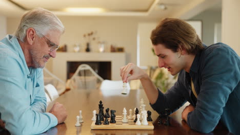 Two people playing chess at home