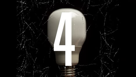 Number animating over light bulb on black background
