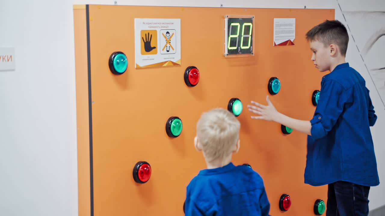 The boys participating activities at science exhibition museum