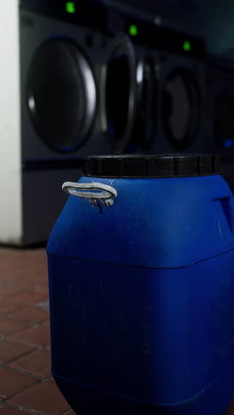 blue barrel in a laundry room