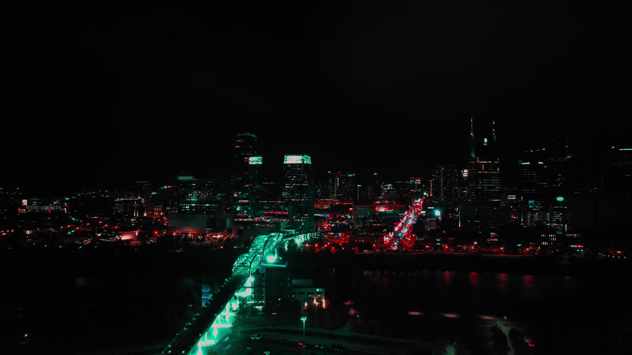 Aerial drone's view over city landscape with lights and skyscrapers