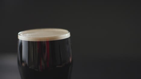 close up of pint of irish stout in glass to celebrate st patricks day 10