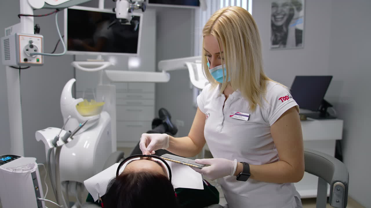 Woman having visit at the dentist. Beautiful young woman having dental check up at dentist office