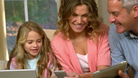 Happy family using technology
