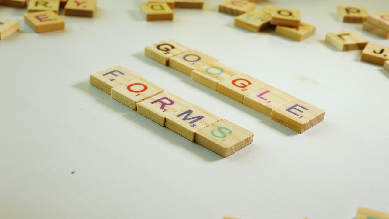 Google Forms spelled with wooden tiles letters