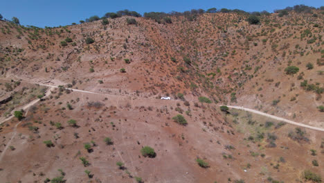 Car-going-up-the-hill-in-Talagante,-Santiago-Chile