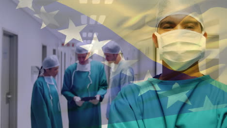 animation of bosnia and herzegovina flag over biracial male surgeon standing in hospital corridor