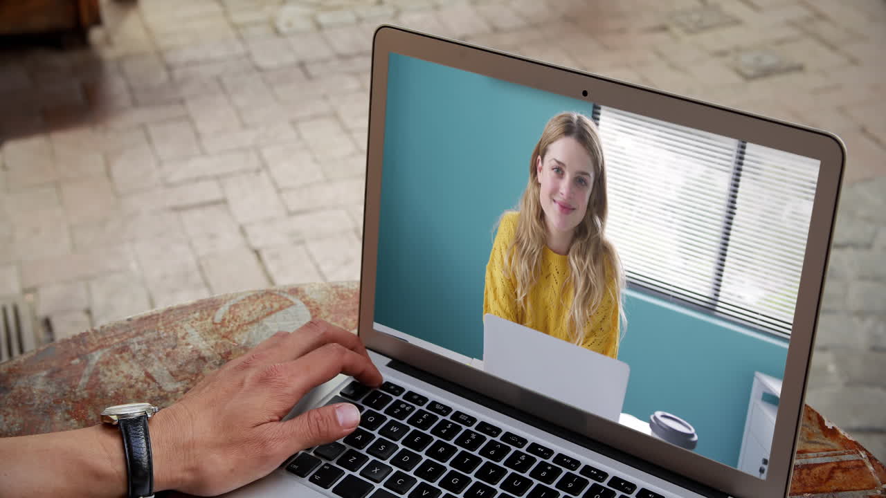 Man having a video conference with a woman