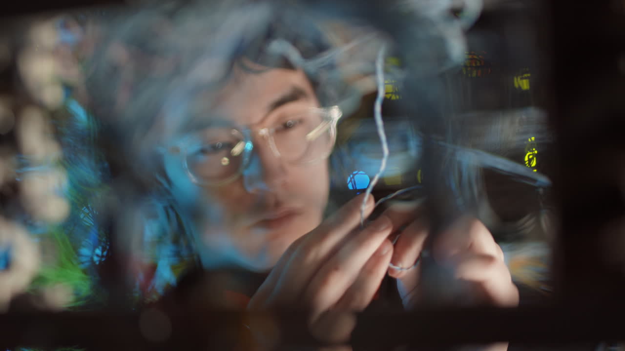 Male Asian IT Engineer Working in Server Room