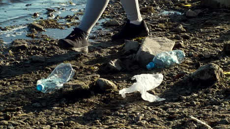 cleaning up plastic pollution on a riverbank