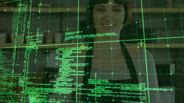 Woman guiding digital interface in tech workshop, displaying neon green grid and scrolling code
