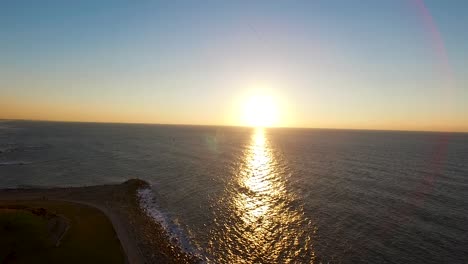 drone flying above the sea. sunset israel