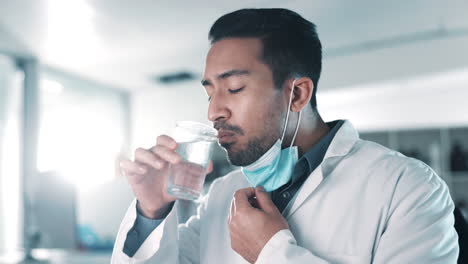 Thirsty-scientist,-man-and-face-mask-in-a-lab