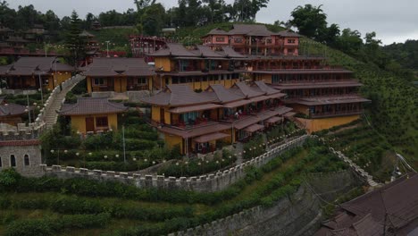 A-drone-shot-of-slope-house-in-Ban-Rak-Thai-village,-Mae-Hong-Son,-Thailand