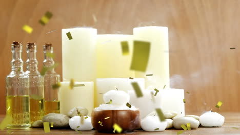 animación de confeti de oro cayendo sobre velas siendo sopladas y aceites en la superficie de madera
