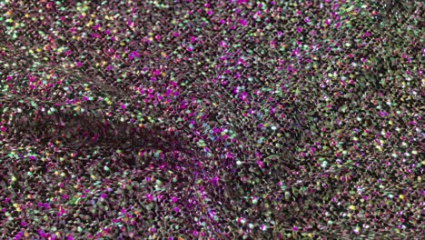 close-up view of a vibrant, multicolored, glittery fabric