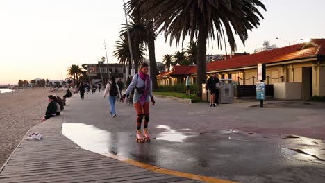 person roller skating near beachside path