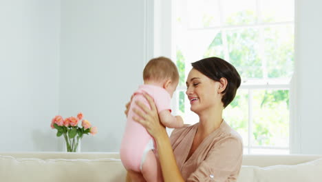 Cute-mother-playing-and-embracing-her-baby-