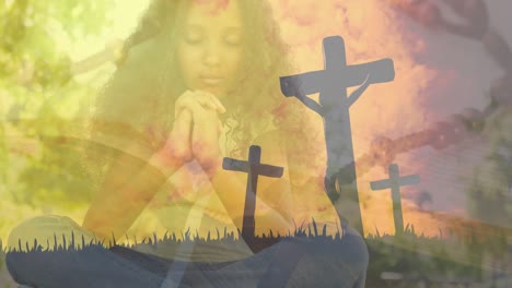 Animation-of-crosses-over-african-american-girl-praying