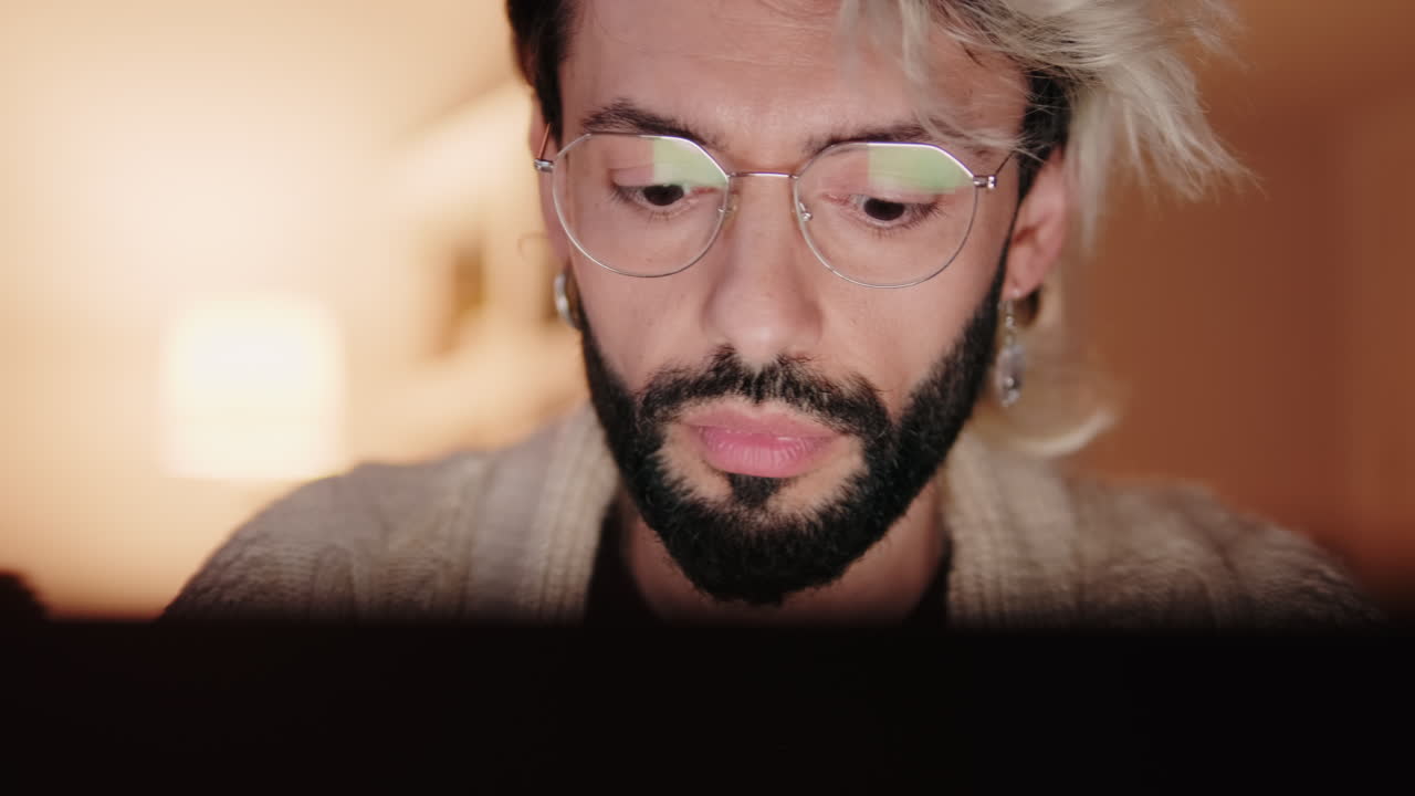 Gay Couple Working From Home on Laptop