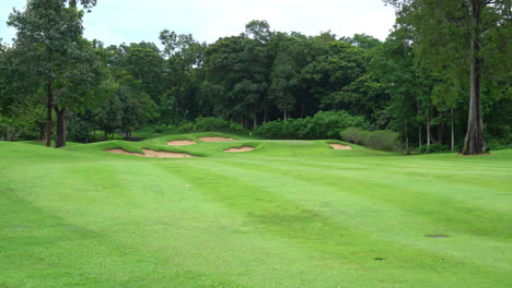 beautiful golf course with mountain hill background