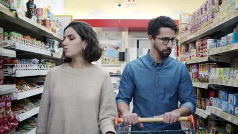 couple buying products in grocery store