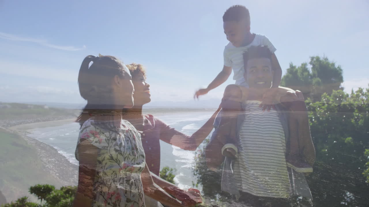 Family standing on coastal cliff viewpoint, showcasing health graph overlay and floating heart icon
