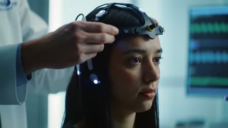 exploring the intersection of neuroscience and robotics: a woman engaged in brain-computer interface research with advanced technology and a robotic arm