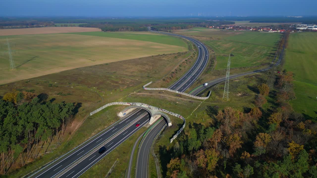 Wildlife crossings Ecoduct, ecopassage, nature ecopassage or green bridge, game changeover. highway in Germany Infrastructure for animals. Unique aerial view flight panorama orbit circle drone footage