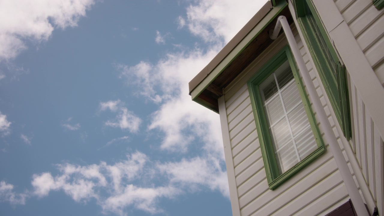 Colorful floating home against blue sky background