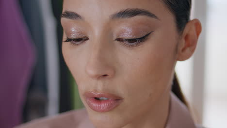 closeup makeup model talking at house. serious woman speaking alone at studio