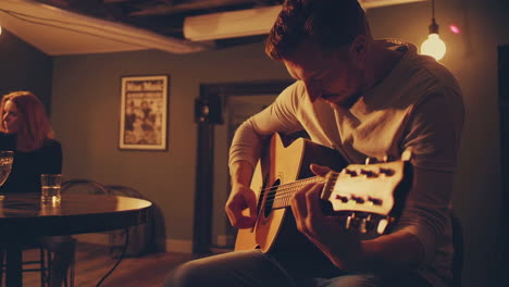 acoustic guitar performance in a cozy bar