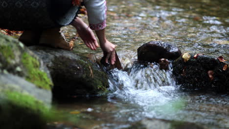 romanian girl plays with sticks in the water 3