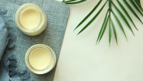 creamy dessert in jars with a blue cloth