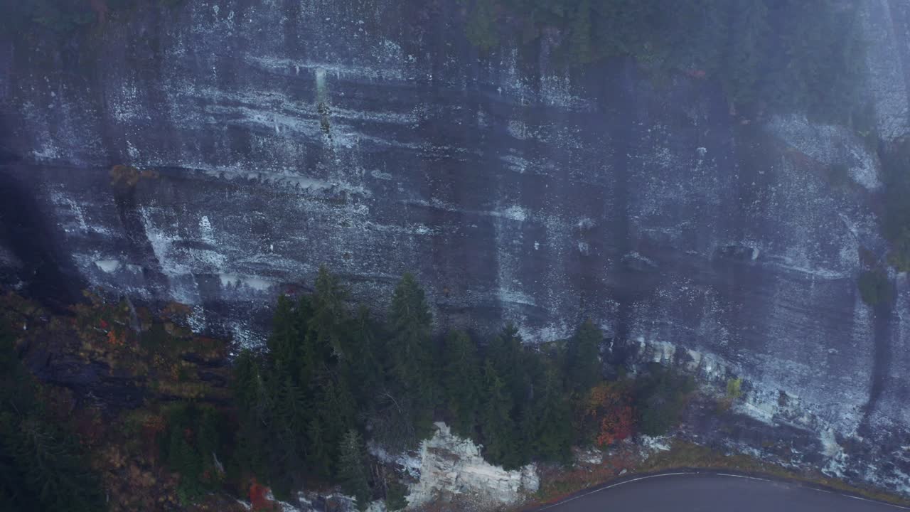 Flying through the clouds above mountain tops