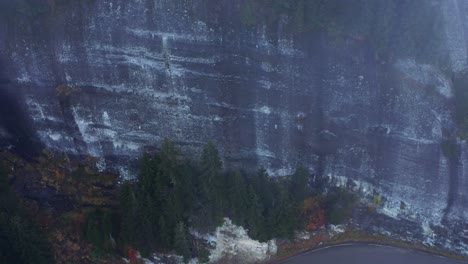 flying through the clouds above mountain tops