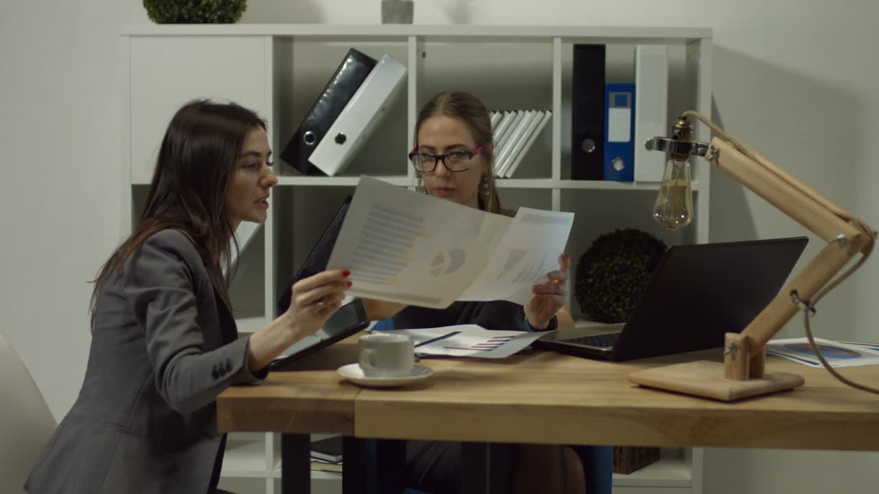 Serious businesswomen working togehter at office