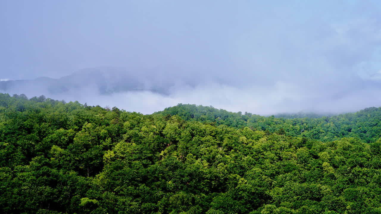 Cinematic drone footage entering a hazy Smoky Mountain morning