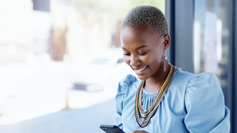 Phone,-typing-and-black-woman-laughing-in-office