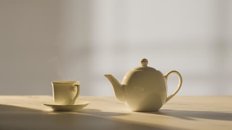 Studio-Shot-Of-Making-Traditional-British-Cup-Of-Tea-Using-Teapot-8