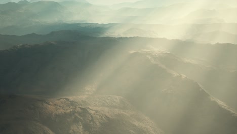 aerial vulcanic desert landscape with rays of light