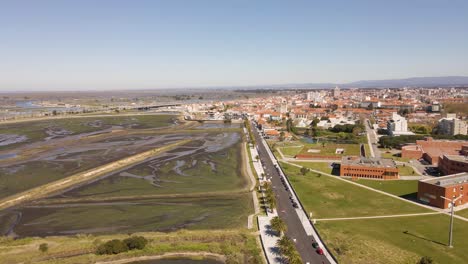 4k aerial view of aveiro city on the left side of the street and the saline’s in the right side, 6ofps