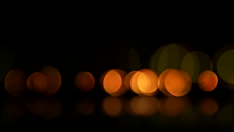 seamless loop abstract motion background. animation of bokeh or defocus orange particles and reflection.