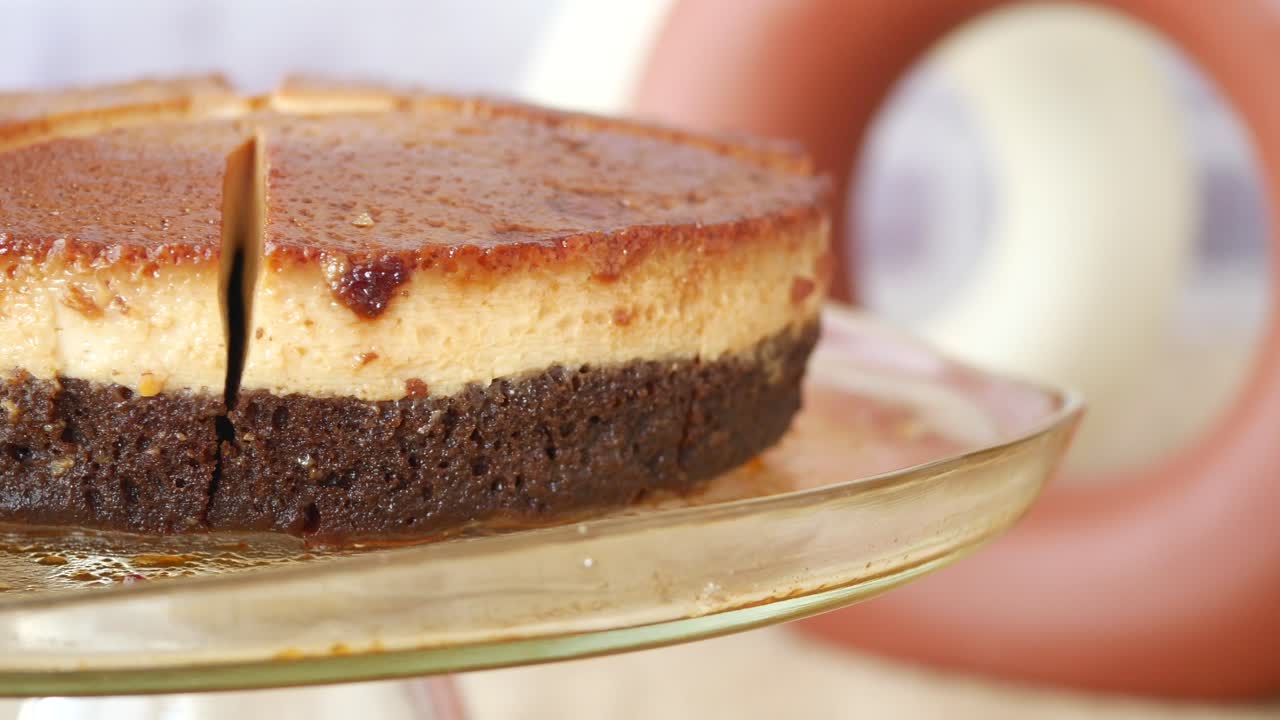 Sliced Caramel Custard Cake on a Glass Stand